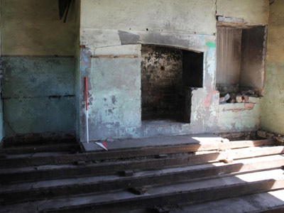 The new kitchen with the original cement floor below the later timber floor (Source CRM 2016)