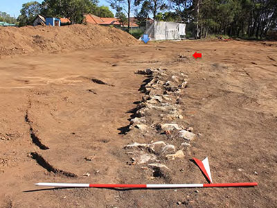 Sandstone floor in relation to the wall foundations